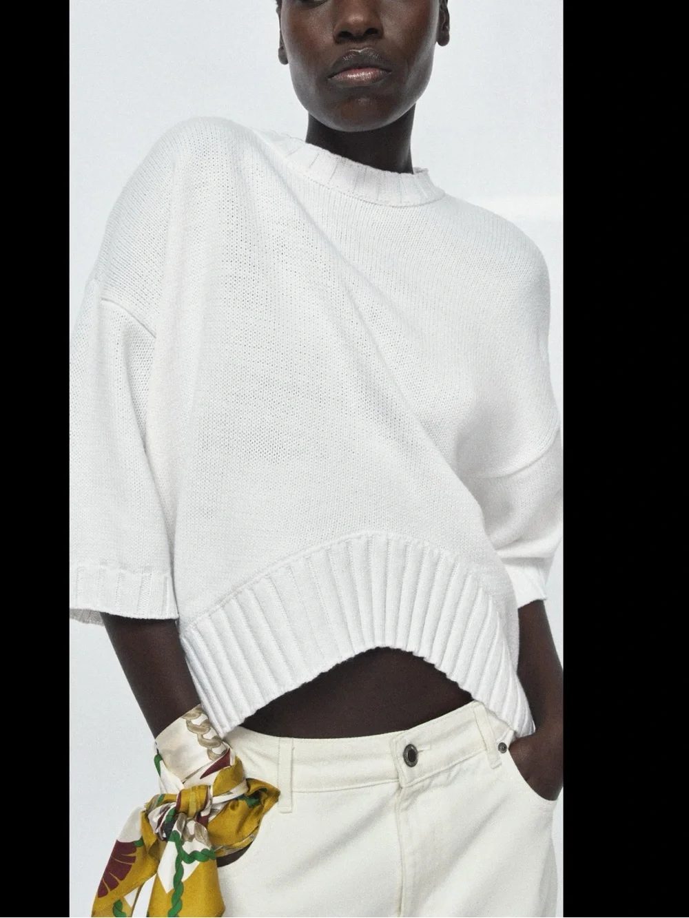 ZARA Loose-fit round neck short sleeve jumper with asymmetric hem.
